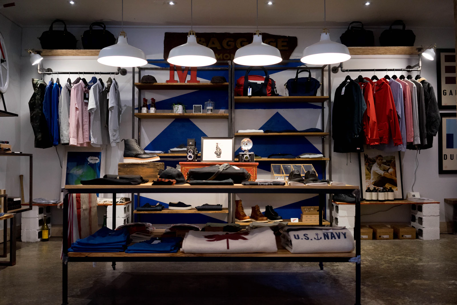 Boutique retail store interior with display shelving, hanging rails and track lighting