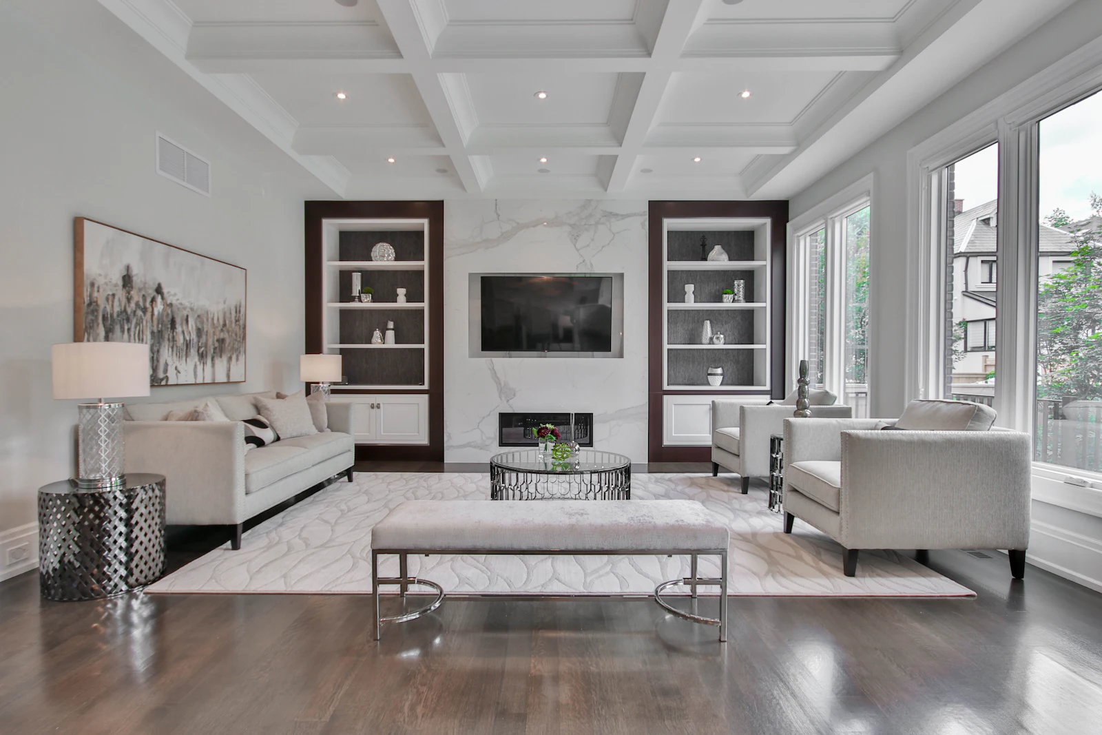 Formal living room with coffered false ceiling and built-in TV unit