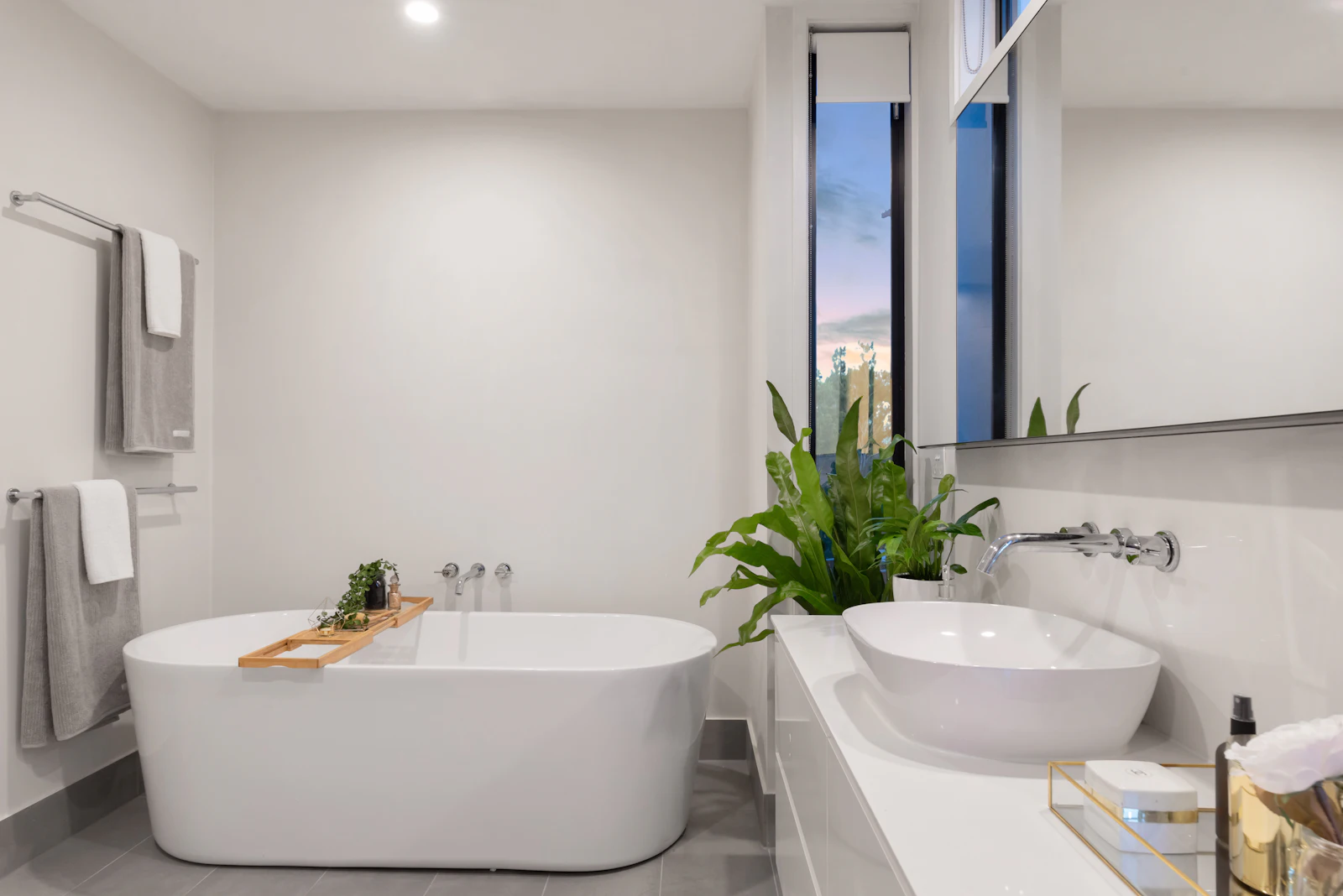 Spa-like bathroom with freestanding tub and minimal stone finishes