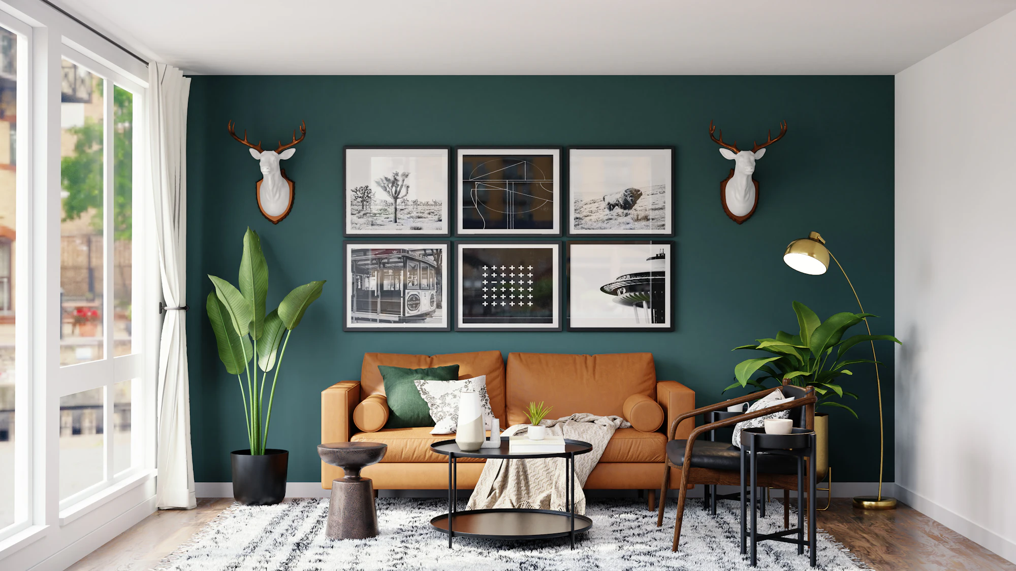 Living room with deep teal accent wall, leather sofa and gallery frames